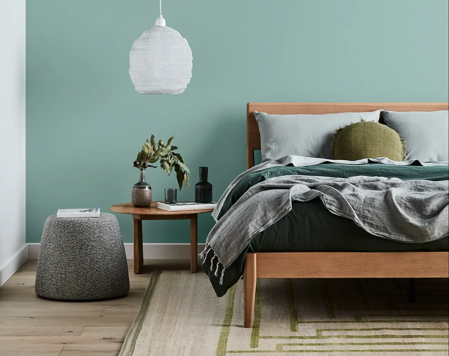 Sage green bedroom feature wall
